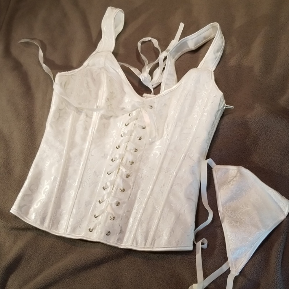 Womens white bridal corset with shoulder straps.